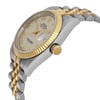 An image of a pre-owned men's luxury Rolex wristwatch, viewed from the side profile with the crown prominently showing. The watch features a round stainless steel case with a gold bezel. The dial is cream-colored and includes a date indicator. The condition is classified as good. The watch is positioned at an angle, highlighting the combination of materials and craftsmanship.