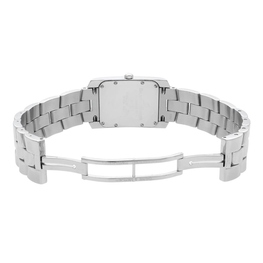 An image of a pre-owned wristwatch viewed from the back, showcasing an open clasp. The watch features a metal link band and a rectangular case. The photo is taken from a straight-on angle, clearly displaying the details of the clasp and the back of the case from a moderate distance.