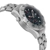 An image of a pre-owned OMEGA men's diver wristwatch, shown in a side profile view opposite the crown. The watch has a round stainless steel case and band, featuring a gray bezel and a blue dial with chronograph and date indicator. Luminous hands are visible on the dial, and a helium escape valve is positioned on the side of the case. The image is taken from a close, slightly elevated angle to highlight the watch's side profile and design details. Light scratches on the bezel. Minor signs of wear on the watch.