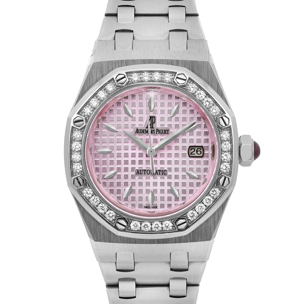 An image of a pre-owned Audemars Piguet.Lady Royal Oak 33mm women's wristwatch, centered and viewed from a straight-on angle at a close distance. The watch features a pink patterned dial and a diamond-studded bezel. The steel metal bracelet and case are also visible, with the crown on the right side. The watch displays the brand name and the date on the right side of the dial.