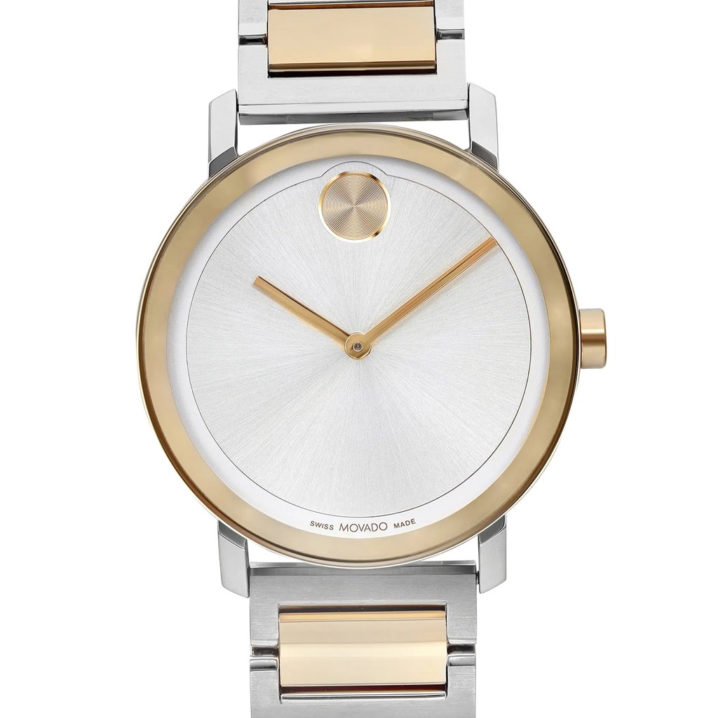 An image of a pre-owned wristwatch, shown in a front close-up shot focusing on the watch face. The watch features a sleek silver dial with gold accents, including minimalist gold hour and minute hands. A prominent gold circle is positioned at the 12 o'clock mark. The silver and gold watch band is partially visible at the top and bottom edges of the image.
