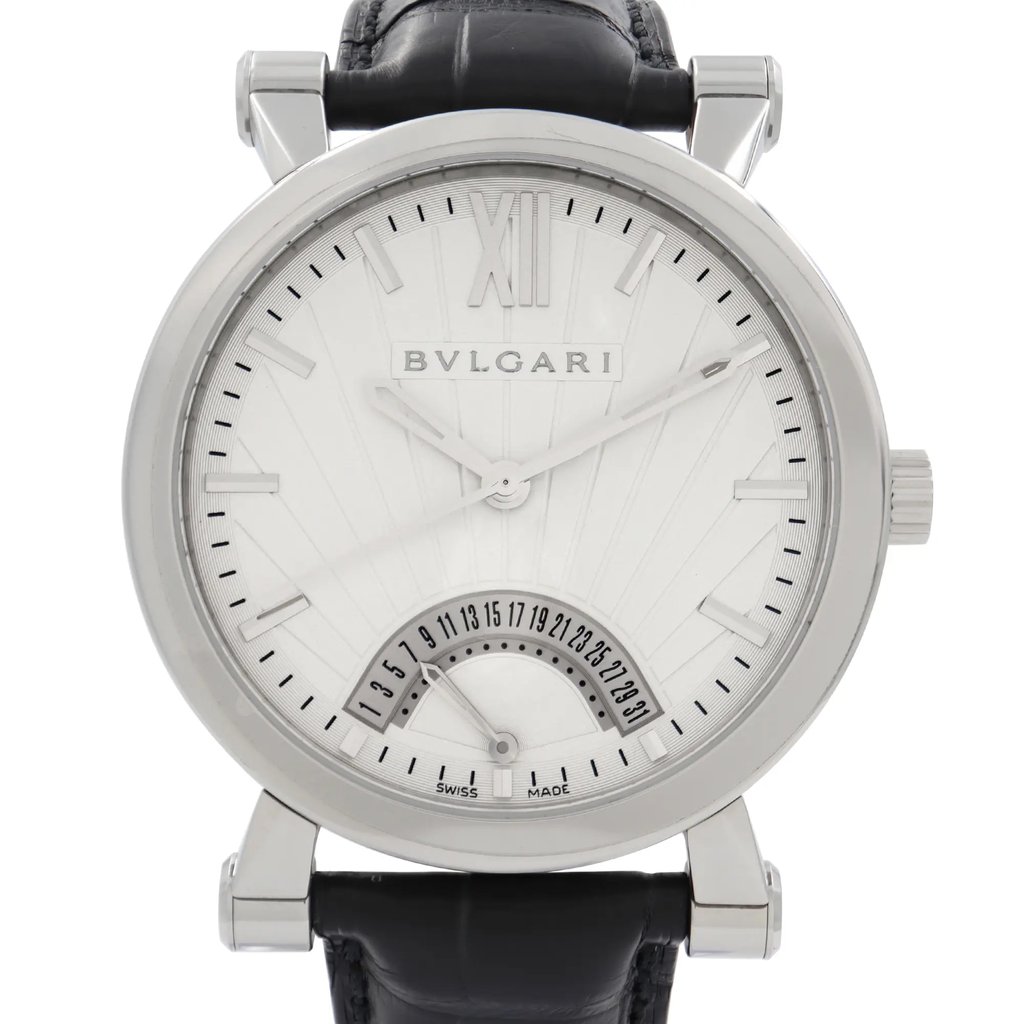 An image of a wristwatch taken from a front close-up angle, showcasing the watch face in detail. The watch features a silver-toned dial with linear markers and Roman numeral XII at the top. The brand name "Bvlgari" is displayed prominently below the numeral. A date subdial is positioned at the bottom center. The watch has a black leather strap, and the image highlights the sleek and polished design, typical of a display model.