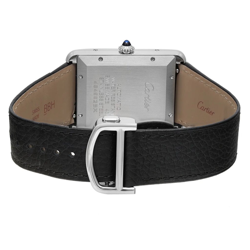 An image of a Cartier men's wristwatch, display model, viewed from the back showing the screwback case. The stainless steel case is rectangular with the brand's name engraved, and it is attached to a black leather band with a deployant clasp. The watch is positioned with the caseback facing up and the closure visible in the foreground, photographed from a top-down angle at close distance. The watch may have minor blemishes due to store handling.