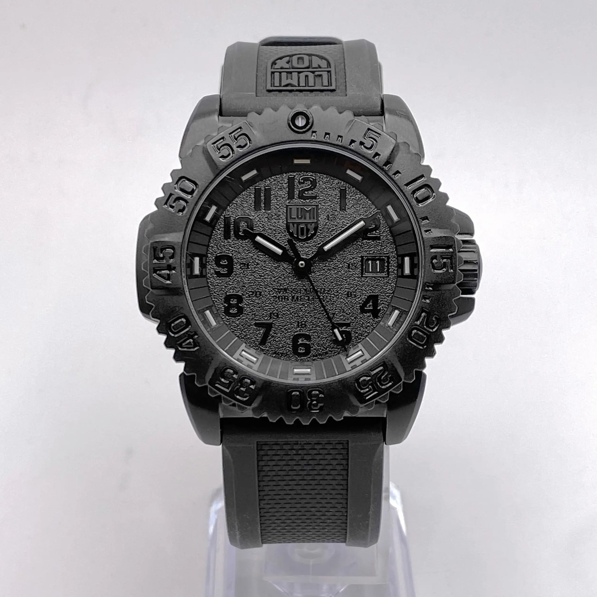 An image of a Wristwatch by Luminox. This Pre Owned item is designed for Men, featuring a Casual,Diver style. It has a Quartz movement and an Analog display with a Black dial color. The indices include 12-Hour Dial,Arabic Numerals. The band is made of Rubber and the case is made of Stainless Steel. The watch has a Round shape with a case size of 44 mm and a case thickness of 13 mm.