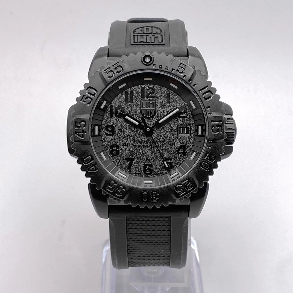 An image of a Wristwatch by Luminox. This Pre Owned item is designed for Men, featuring a Casual,Diver style. It has a Quartz movement and an Analog display with a Black dial color. The indices include 12-Hour Dial,Arabic Numerals. The band is made of Rubber and the case is made of Stainless Steel. The watch has a Round shape with a case size of 44 mm and a case thickness of 13 mm.