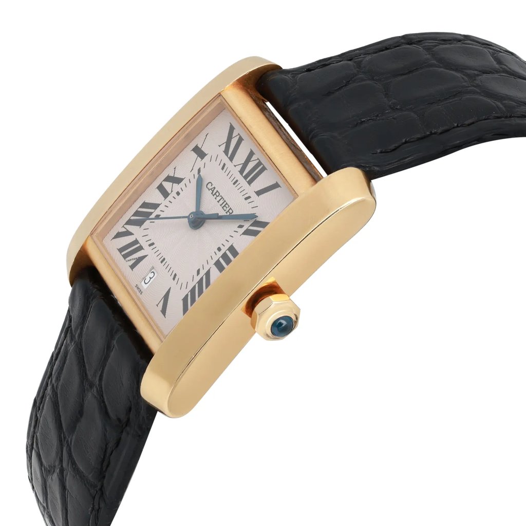 An image of a pre-owned Cartier unisex adult wristwatch, positioned at a close angle. The watch features a gold rectangular case with a white dial displaying Roman numerals and a date indicator at the bottom left. It has a black leather strap and a prominent crown with a blue cabochon. The watch is viewed from the side, emphasizing its elegant design.