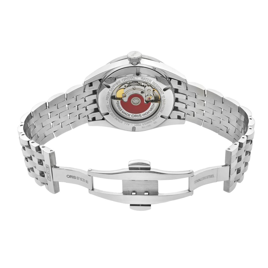 An image of a wristwatch taken from a back view at a close distance, showcasing the open clasp. The watch features a stainless steel band with a visible mechanical movement on the back of the watch face. The clasp is fully extended, highlighting the intricate links and design of the band. The watch is a display model, indicating pristine condition.