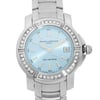 An image of a pre-owned wristwatch taken from a front close-up angle, focusing on the watch face. The watch features a silver metallic bracelet and a light blue dial with silver hour markers and hands. The bezel is adorned with sparkling stones, and the brand name "Baume & Mercier" is visible on the dial. The date window is positioned at 3 o'clock, and the watch is water-resistant up to 100 meters.