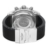 An image of a pre-owned Breitling men's wristwatch, viewed from the back, showcasing the solid stainless steel caseback and rubber band. The watch is positioned with the caseback facing up and the deployant clasp of the band open and angled to the right side, providing a clear view of the Breitling logo on the clasp. The distance is close enough to reveal the text and engravings on the caseback and clasp in detail. The band may show minor signs of wear.