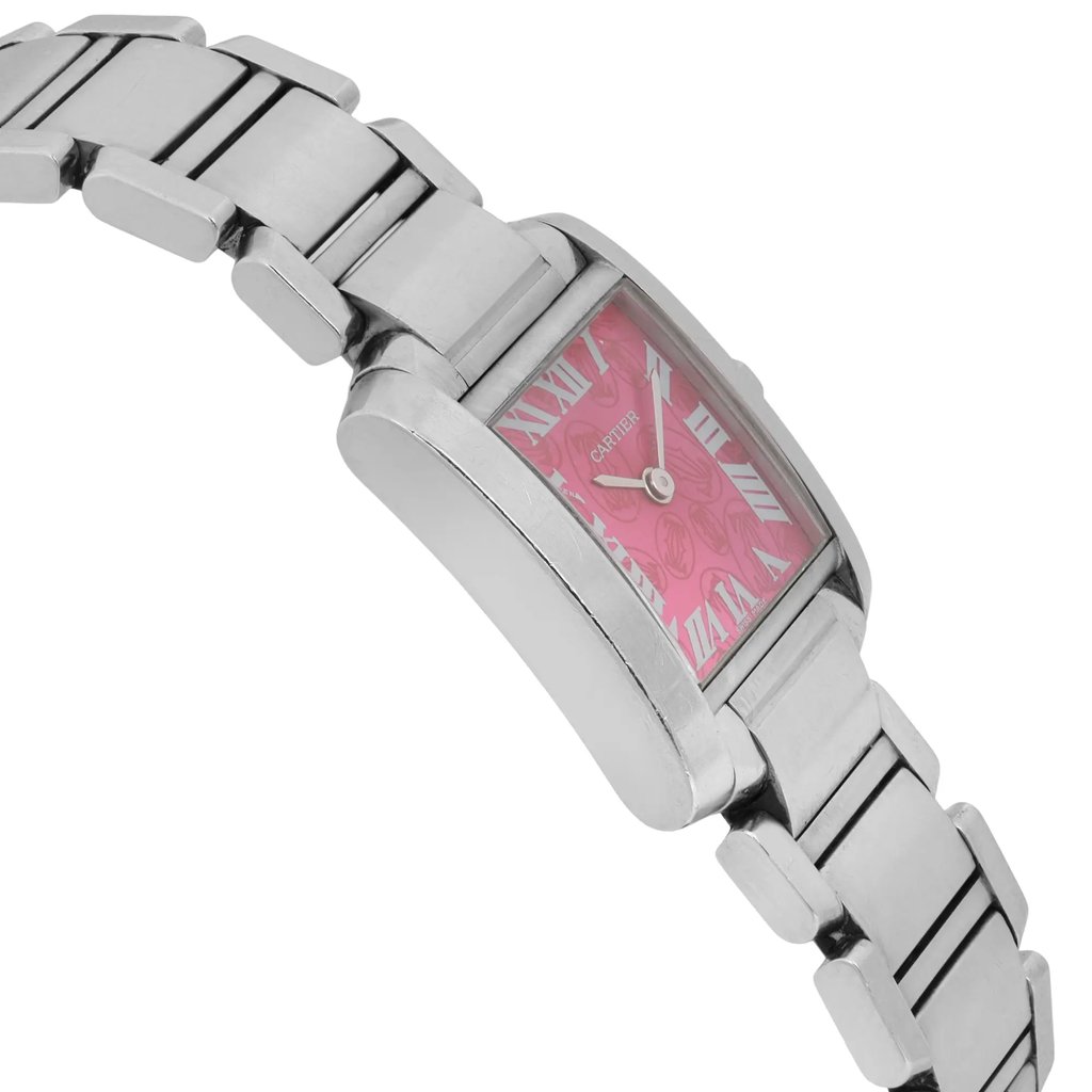 An image of a pre-owned Cartier women's wristwatch, angled slightly from the side, showing the stainless steel bracelet and rectangular case. The watch face is pink with Roman numerals, and the view captures a close-up perspective, highlighting the details of the timepiece's design.