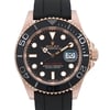 An image of a pre-owned men's Rolex wristwatch viewed from the front at a close angle. The watch features a black dial with luminous hands and a date indicator on the right side. The bezel is marked with large numerals, and the watch is fitted with a black strap.