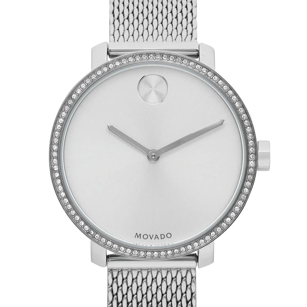 An image of a Wristwatch by Movado. This Pre Owned item is designed for Women, featuring a Casual style. It has a Quartz movement and an Analog display with a Silver dial color. The indices include 12-Hour Dial,Non-Numeric Hour Marks. The band is made of Stainless Steel and the case is made of Stainless Steel. The watch has a Round shape with a case size of 34 mm and a case thickness of 8 mm.