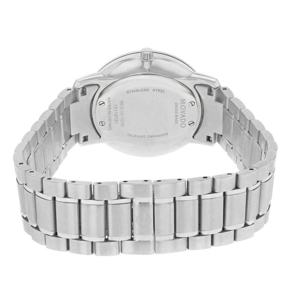 An image of a pre-owned wristwatch shown from the back view. The focus is on the closed clasp and stainless steel band, angled slightly downward. The watch case is centrally positioned, with engraved details visible. The shot is taken at a close distance, highlighting the metal links and backplate.