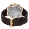 An image of a pre-owned wristwatch showcasing the back view. The watch features a round stainless steel case with a gold-tone finish and three pushers. It is positioned at a slight angle, allowing a clear view of the engraved markings on the case back. The dark brown leather strap is visible, with a gold-tone buckle clasp fastened. The image is taken from a close distance, highlighting the details of the clasp and case back.