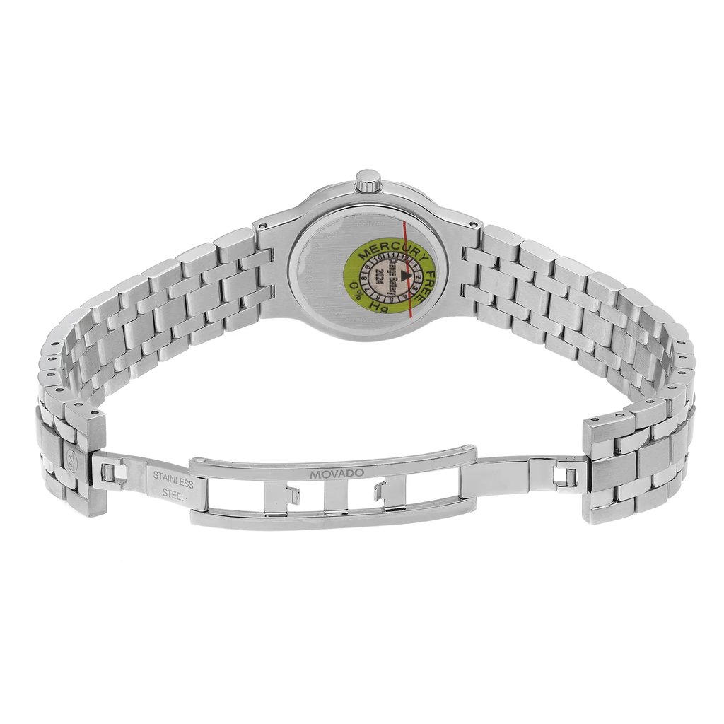 An image of a wristwatch showcasing the back view with an open clasp, positioned at a slight angle to reveal the details of the stainless steel bracelet and the brand name on the clasp. The photograph is taken from a close distance, highlighting the unworn condition and the intricate design on the watch's back.