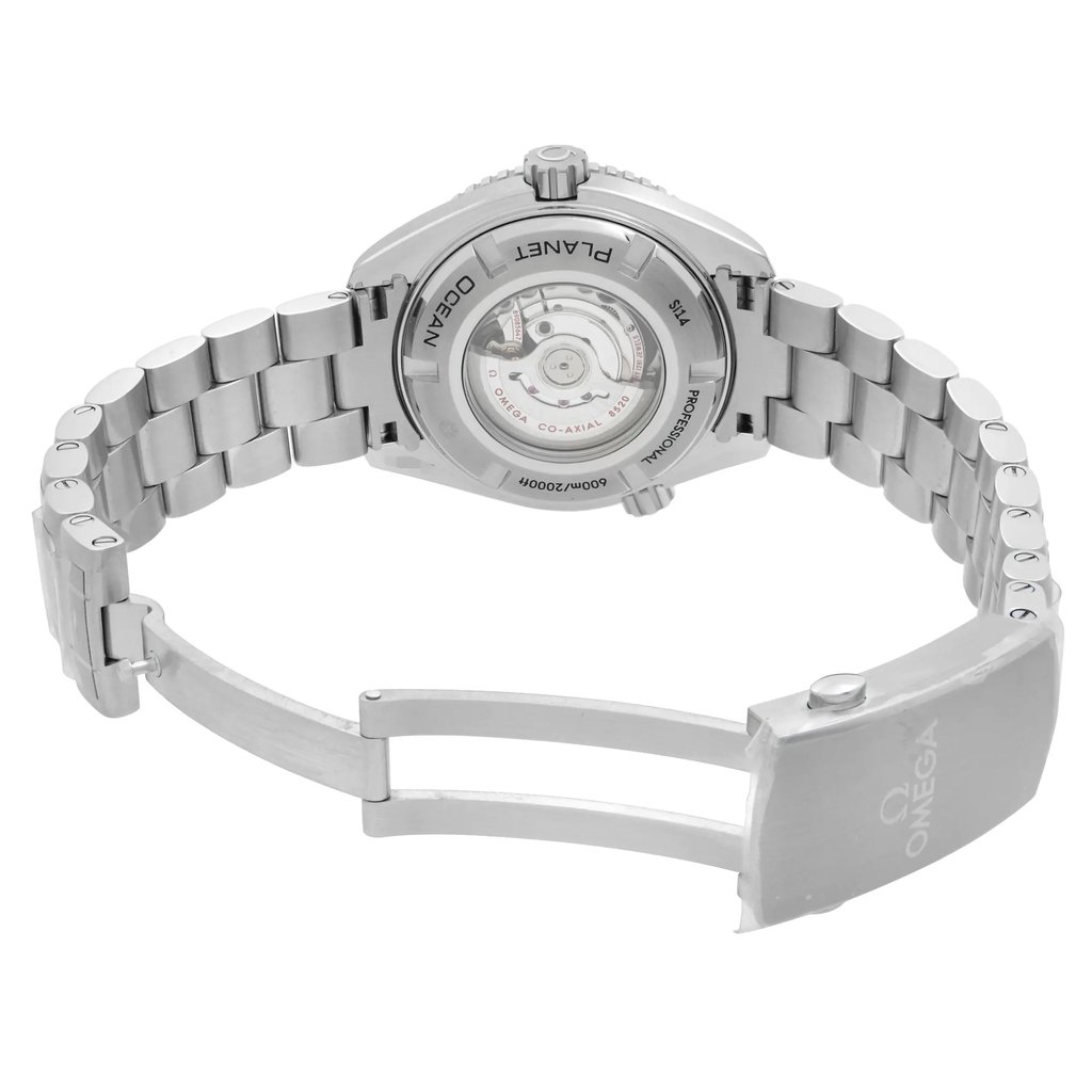 An image of an unworn women's OMEGA wristwatch in excellent condition, showcasing the back view with an open clasp. The watch features a stainless steel case and band, with an exhibition caseback revealing the internal mechanism. The round watch shape is complemented by a fold-over clasp with a double push button. The photograph captures the watch from a medium distance and slightly elevated angle, emphasizing the stainless steel material and craftsmanship.