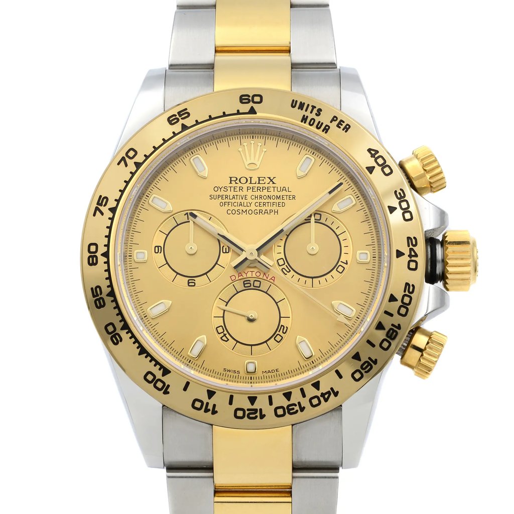 An image of a pre-owned men's luxury Rolex wristwatch, captured from a front close-up angle focusing on the watch face. The dial is champagne-colored, featuring a chronograph with luminous hands and stick indexes. The bezel is gold, complementing the stainless steel and yellow gold band. The round case is made of stainless steel, and the watch includes features like a small seconds subdial. The overall condition is classified as good.