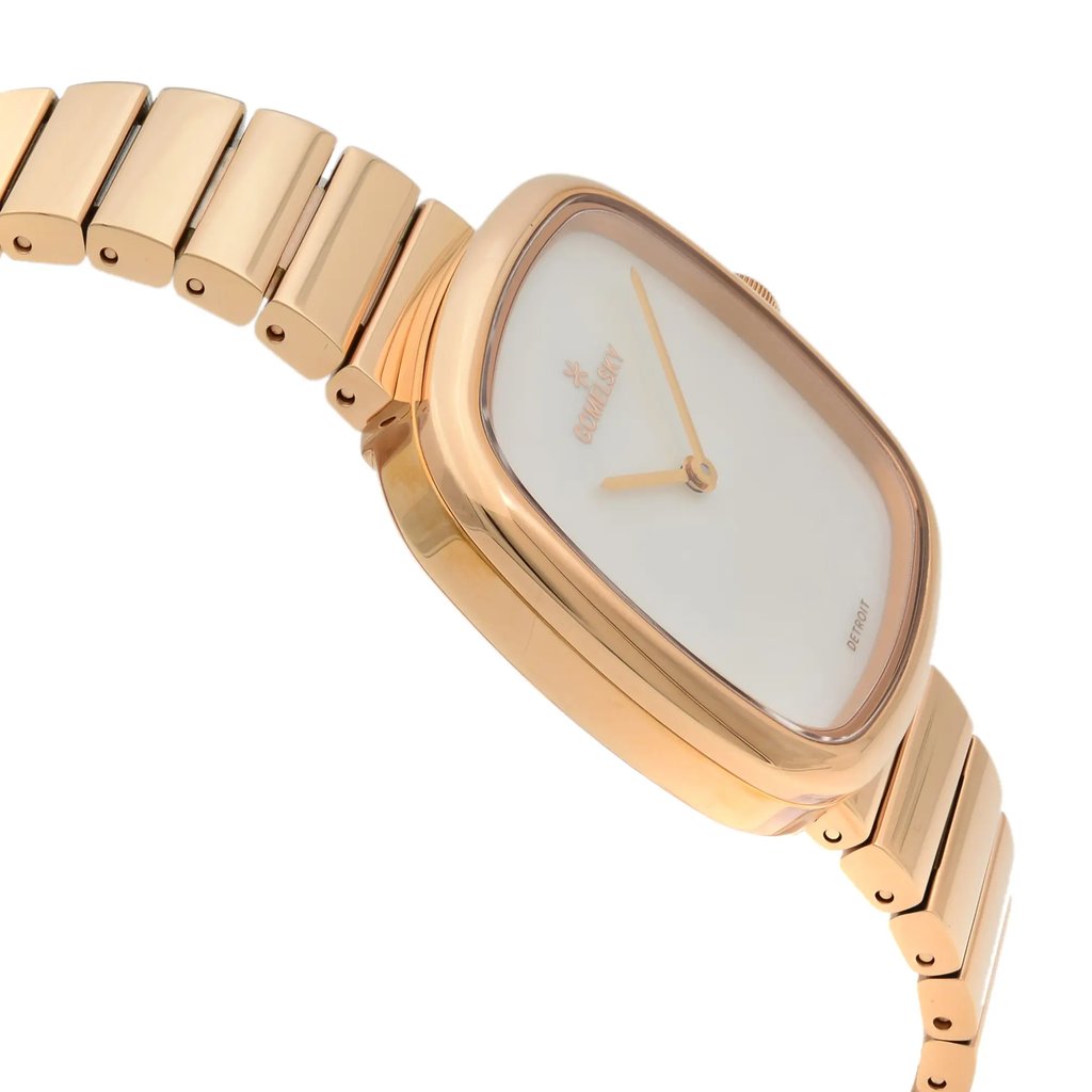 An image of a wristwatch in an unworn condition, viewed from the side profile opposite the crown. The watch features a rectangular, rose gold-colored case with a smooth, minimalist design. The face is white with matching rose gold hands. It is attached to a metal link bracelet of the same color. The angle captures the watch from a slightly elevated perspective, showcasing the sleek design and craftsmanship.