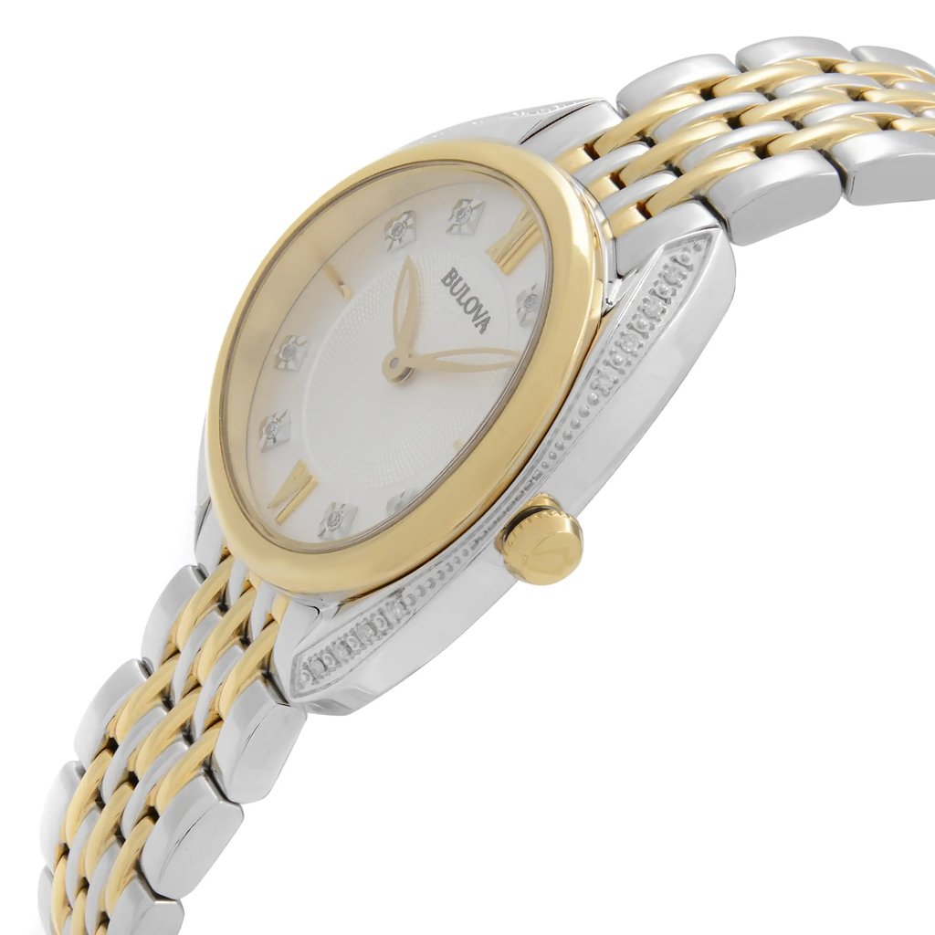 An image of a Bulova women's wristwatch in display model condition, showcasing a side profile view with the crown visible. The watch features a round silver dial, yellow gold-tone bezel, and a stainless steel band with a two-tone link pattern. The watch is photographed at a close distance, emphasizing the dial and upper part of the band at a slight angle to demonstrate the watch's design and features.