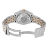 An image of a pre-owned Breitling women's wristwatch in a back view with an open clasp. The round watch case and band are made of stainless steel with yellow gold accents. The screwback caseback features engraved branding and details, and the band has a fold-over clasp with flip lock safety. The watch is positioned at a slight angle, with its left side slightly lifted, offering a clear view of the caseback and band, filling the frame from a medium distance. The watch is pre-owned and may show minor signs of wear.