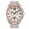 An image of a pre-owned men's Cartier Calibre de Cartier 42mm 18K Rose Gold Steel Ivory Dial Watch W7100042, viewed from a straight-on angle. The watch features a chronograph, date indicator, and luminous hands. The face displays Roman numerals and three sub-dials, with rose gold-tone and stainless steel bracelet. The photograph is taken up close to show intricate details of the design and craftsmanship.