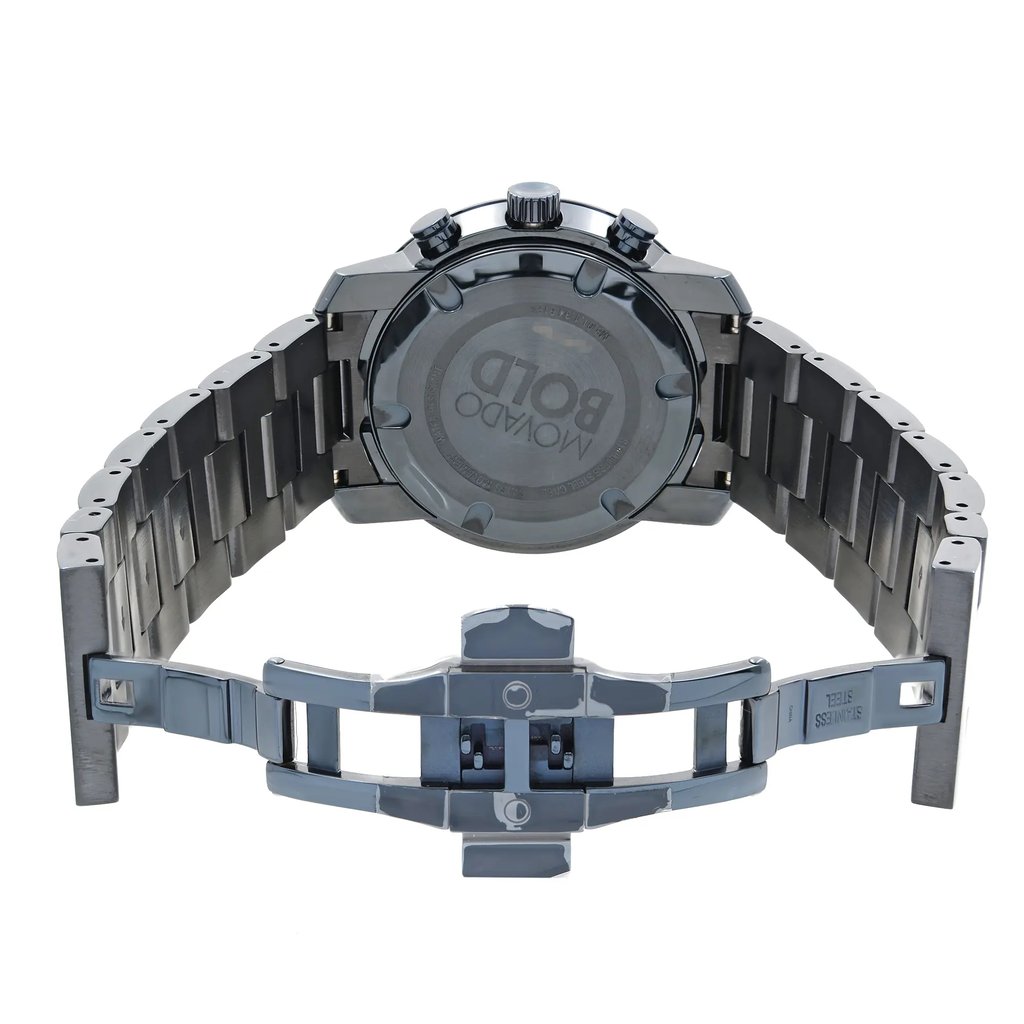 An image of a pre-owned wristwatch showing the back view with an open clasp. The watch is positioned upright, displaying its stainless steel band and the back of the case prominently. The angle captures the detailed design of the open clasp mechanism. The photo is taken at a close distance, highlighting the brand name engraved on the back of the watch case.