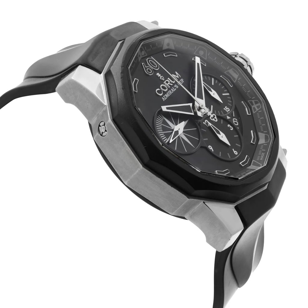 An image of a pre-owned wristwatch viewed from the side profile, opposite the crown. The angle highlights the watch's bezel and the intricate design of the black dial with multiple subdials. The focus is on the case's structure and the band, showing a mix of brushed and polished finishes. The watch is positioned at a close range, capturing details and textures.