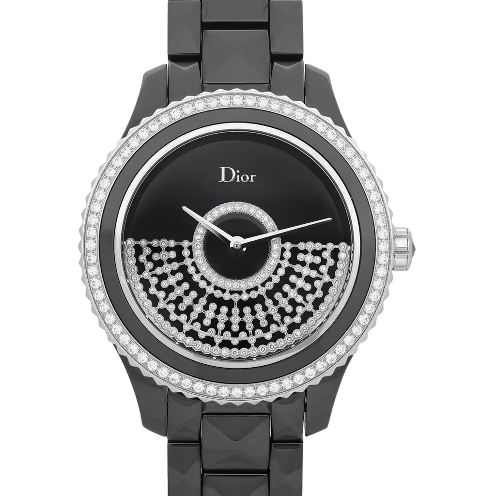 An image of a Wristwatch by Dior. This Display Model item is designed for Women, featuring a Luxury style. It has a Mechanical (Automatic) movement and an Analog display with a Black dial color. The indices include 12-Hour Dial,Non-Numeric Hour Marks. The band is made of Ceramic and the case is made of Ceramic. The watch has a Round shape with a case size of 38 mm and a case thickness of 12 mm.