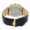 An image of a new Bulova men's wristwatch with defects, viewed from the back showing the solid caseback. The stainless steel case is round, and it is attached to a black leather band with a gold-tone buckle closure. The watch is positioned upside down, with the buckle in the lower foreground and the back of the watch case slightly out of focus towards the upper background. The angle is a close-up, with the inside of the strap visible and the Bulova logo on the buckle clearly visible.