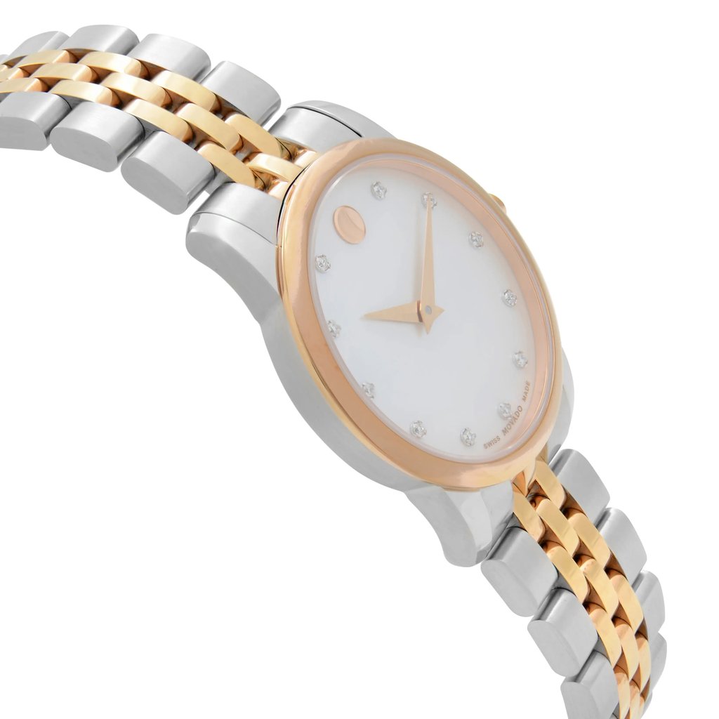 An image of a pre-owned wristwatch shown from a side profile view, opposite the crown. The watch features a metal bracelet with alternating silver and gold links. The watch face is white with minimalist markers and a gold-tone bezel. The photo captures the watch at a slight angle, highlighting its design details.