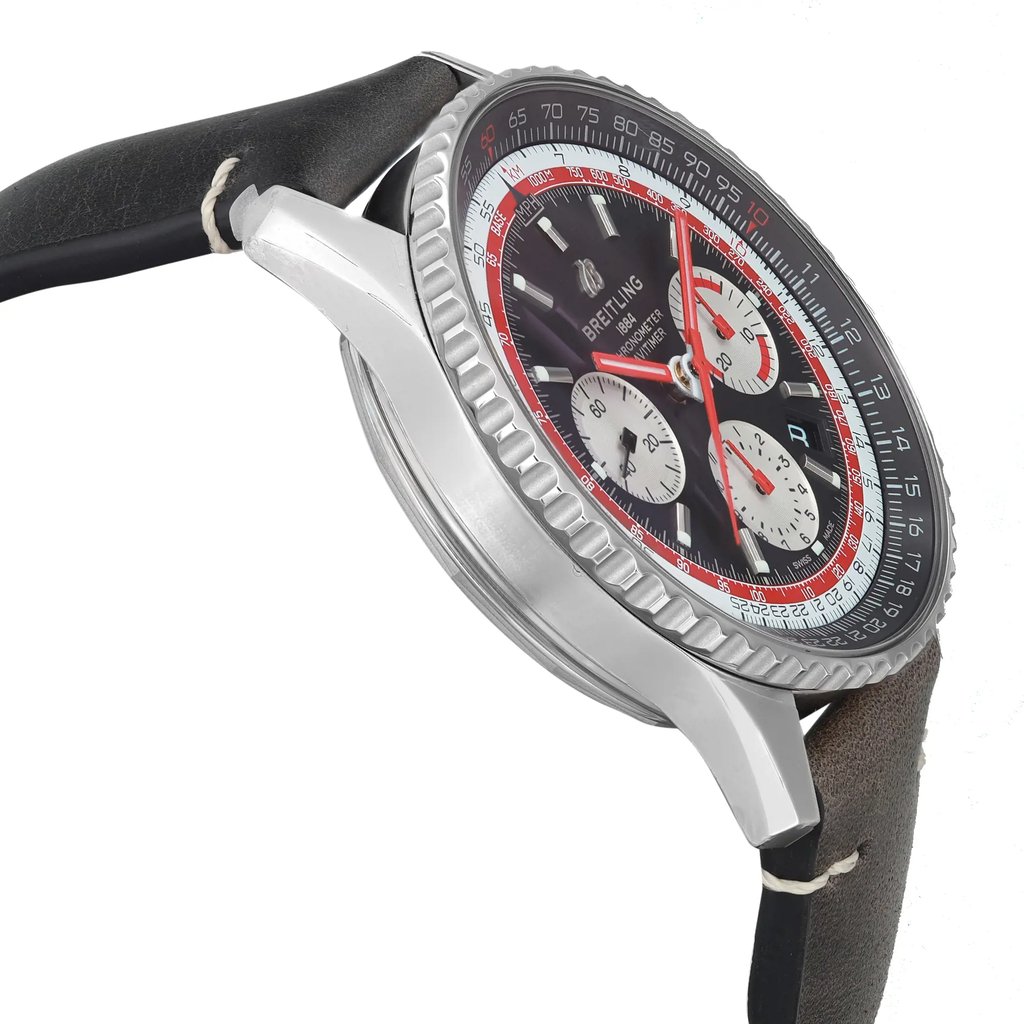 An image of a Breitling men's pilot/aviator wristwatch, displayed in a side profile view opposite of the crown, showcasing its round stainless steel case and gray bezel. The watch is photographed at a close distance, emphasizing the black dial with chronograph features, date indicator, and luminous hands, along with a small seconds subdial. The leather band shows discoloration due to storage, and the angle of the photo provides a clear view of the watch's design and condition as a display model.
