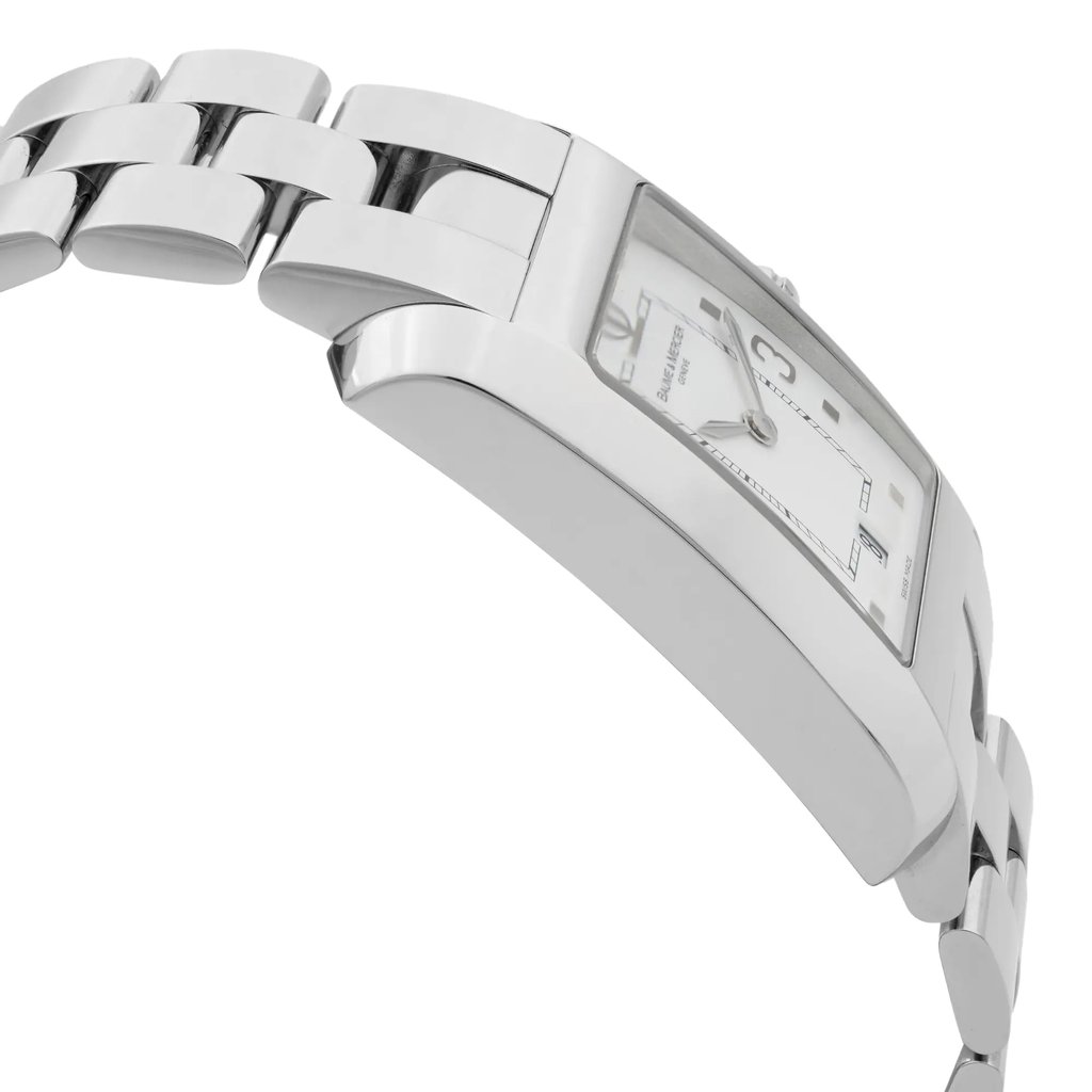 An image of a wristwatch shown from a side profile view, opposite the crown. The watch features a metal bracelet and a rectangular case. The dial is partially visible, displaying a clean and modern design. The photo is taken at a close distance, highlighting the watch's sleek and polished finish, characteristic of a display model.