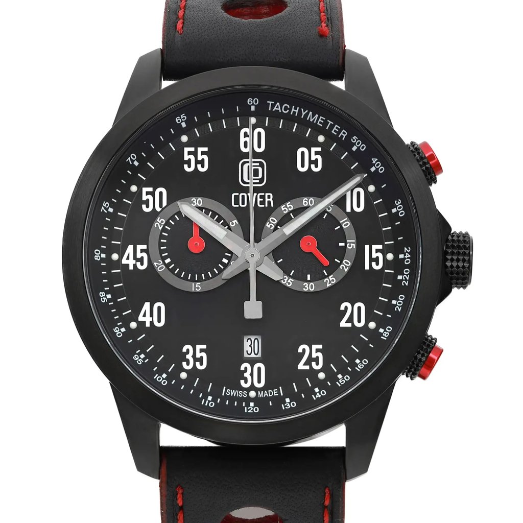 An image of a men's COVER wristwatch with a black dial featuring chronograph functions, a date indicator, and luminous hands. The watch includes two small seconds subdials with red accents. The timepiece is displayed from a front-facing angle at a close distance, highlighting its tachymeter scale and black leather strap with red stitching.