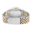 An image of a pre-owned wristwatch viewed from the back, focusing on the closed clasp. The watch features a two-tone metal bracelet with alternating silver and gold links. The angle shows the round case back and a partial view of the crown, with the clasp prominently centered in the foreground. The image is captured at a close distance, highlighting the texture and design details.