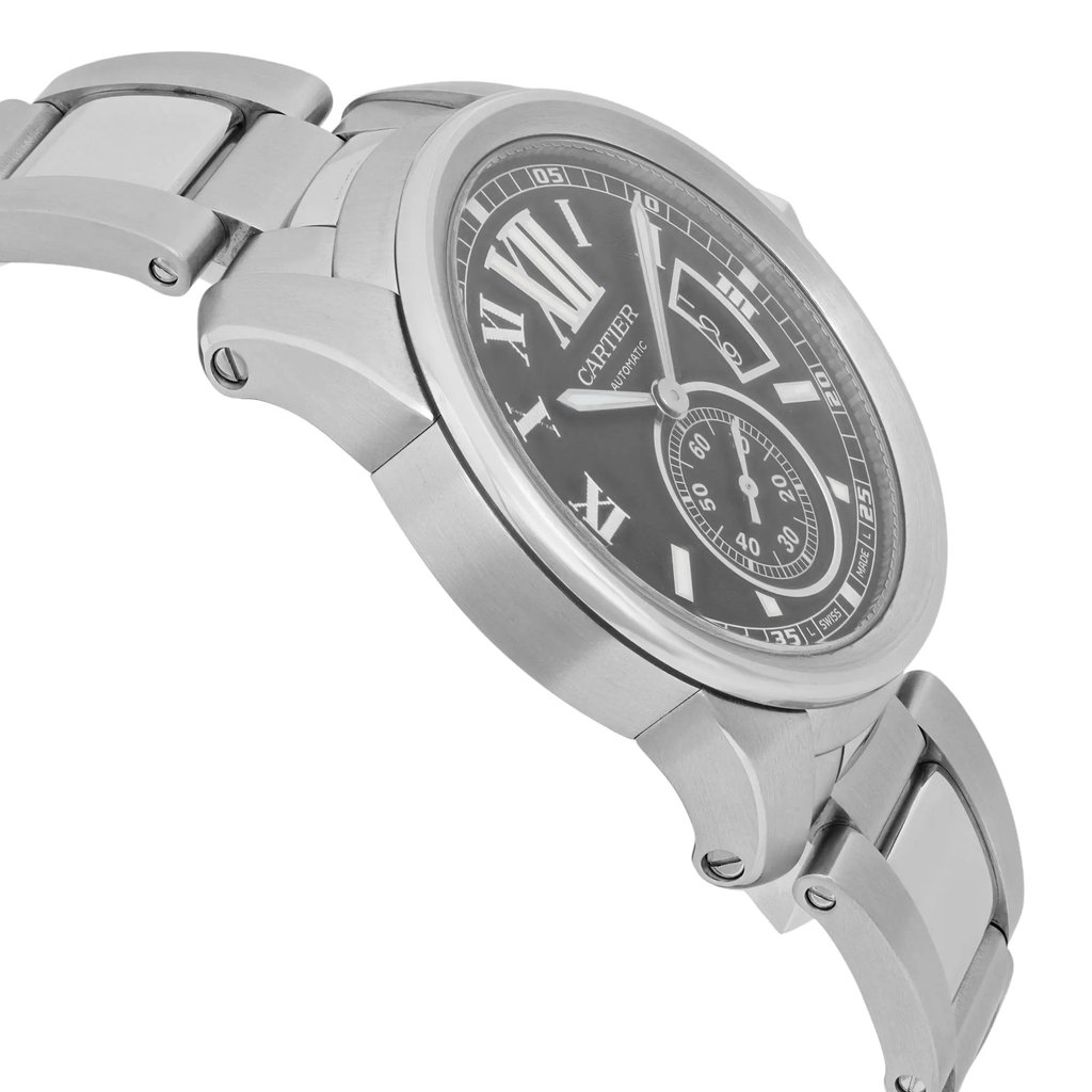 An image of a pre-owned Cartier men's wristwatch taken at an angled side view. The watch is positioned diagonally, showcasing its stainless steel bracelet and case. The black dial features Roman numerals, a date indicator, and luminous hands. The focus is on the watch's detailed design, captured from a close distance.