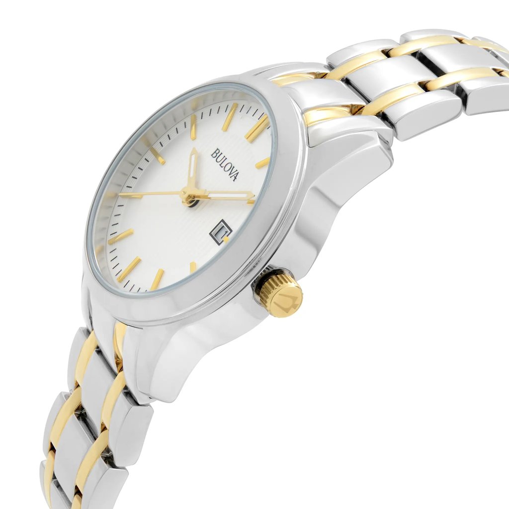 An image of a Bulova women's wristwatch in a display model condition, showcasing a side profile view with the crown visible. The watch features a round, silver sunburst dial with luminous hands and a date indicator. The bezel is made of steel and the band is composed of stainless steel with alternating steel and gold-colored links. The timepiece presents a casual style and is photographed up close, emphasizing the watch's design details and the contrasting colors of the band.