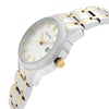 An image of a Bulova women's wristwatch in a display model condition, showcasing a side profile view with the crown visible. The watch features a round, silver sunburst dial with luminous hands and a date indicator. The bezel is made of steel and the band is composed of stainless steel with alternating steel and gold-colored links. The timepiece presents a casual style and is photographed up close, emphasizing the watch's design details and the contrasting colors of the band.