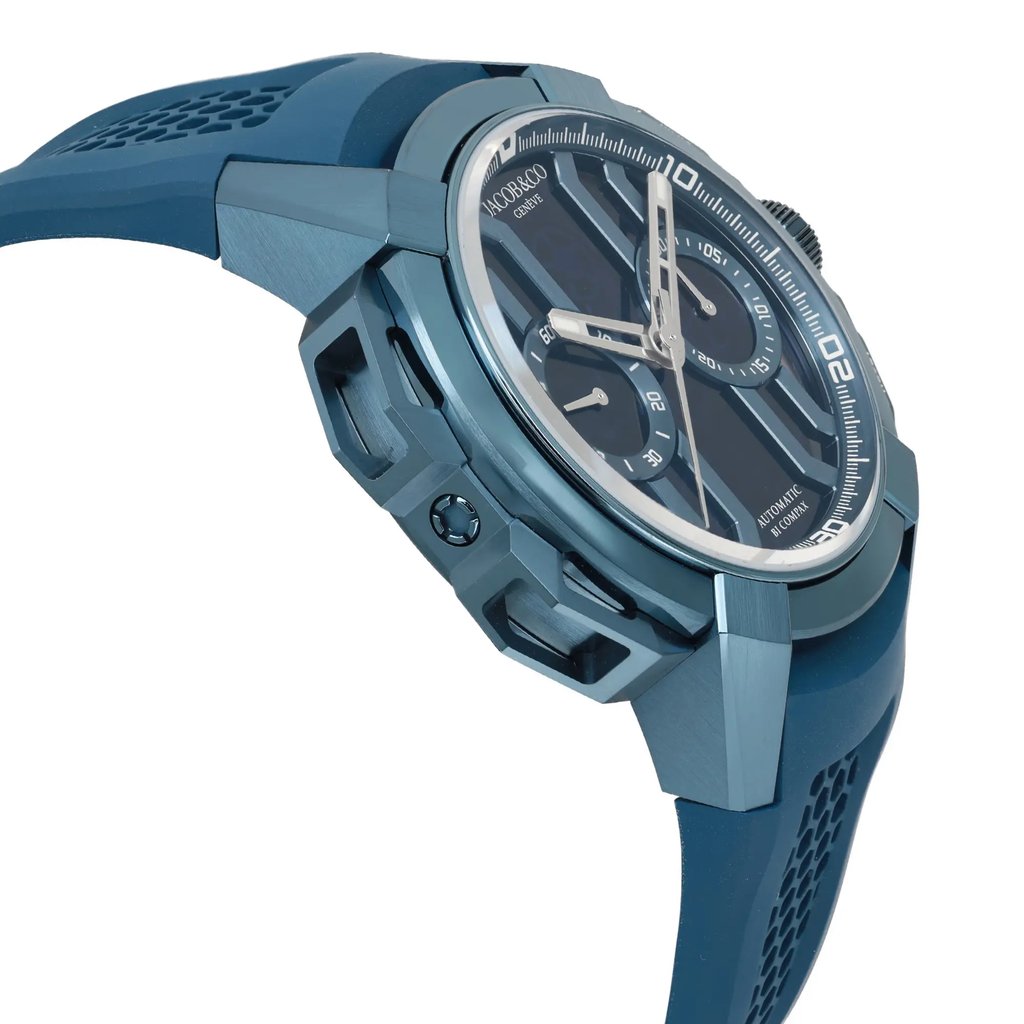 An image of a pre-owned wristwatch taken from a side profile view, opposite the crown. The watch features a blue case and strap with a textured design. The angle highlights the watch's sleek and modern design, with visible details on the dial, including markers and subdials, captured from a close distance.
