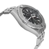 An image of a pre-owned Breitling men's wristwatch in a pilot/aviator style, captured from a side profile view opposite the crown. The watch has a round shape with a black dial and gray bezel, housed in a stainless steel case connected to a stainless steel band. The angle of the photo provides a clear view of the watch's side, showing minor patina on the hour markers and signs of wear indicative of its pre-owned condition. The image is taken at a close distance, emphasizing the watch's details and craftsmanship.
