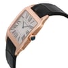 An image of a pre-owned wristwatch shown from a side profile view. The angle highlights the crown on the right side. The watch features a rectangular face with Roman numerals and a black leather strap. The case appears to be a rose gold color, and the crown is adorned with a blue accent. The watch is positioned slightly elevated against a plain background, emphasizing its elegant design.