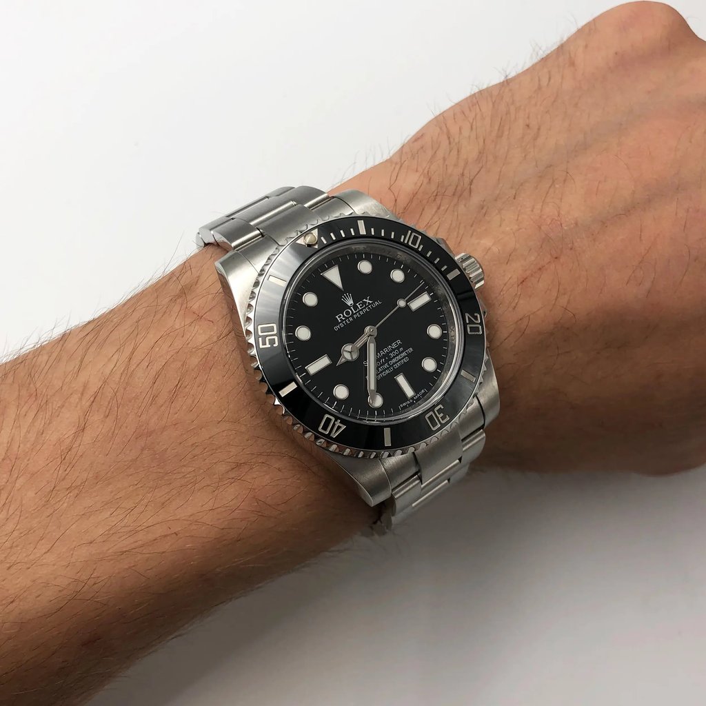 Up Close Front Facing Picture Of Rolex 114060 Stainless Steel Watch Pre Owned Condition