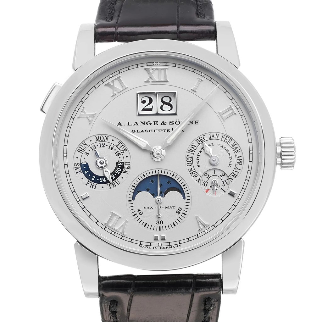 An image of a pre-owned wristwatch captured from a front close-up angle, focusing on the watch face. The timepiece features Roman numerals, subdials, and a date display. The watch has a silver-toned case and a dark leather strap.