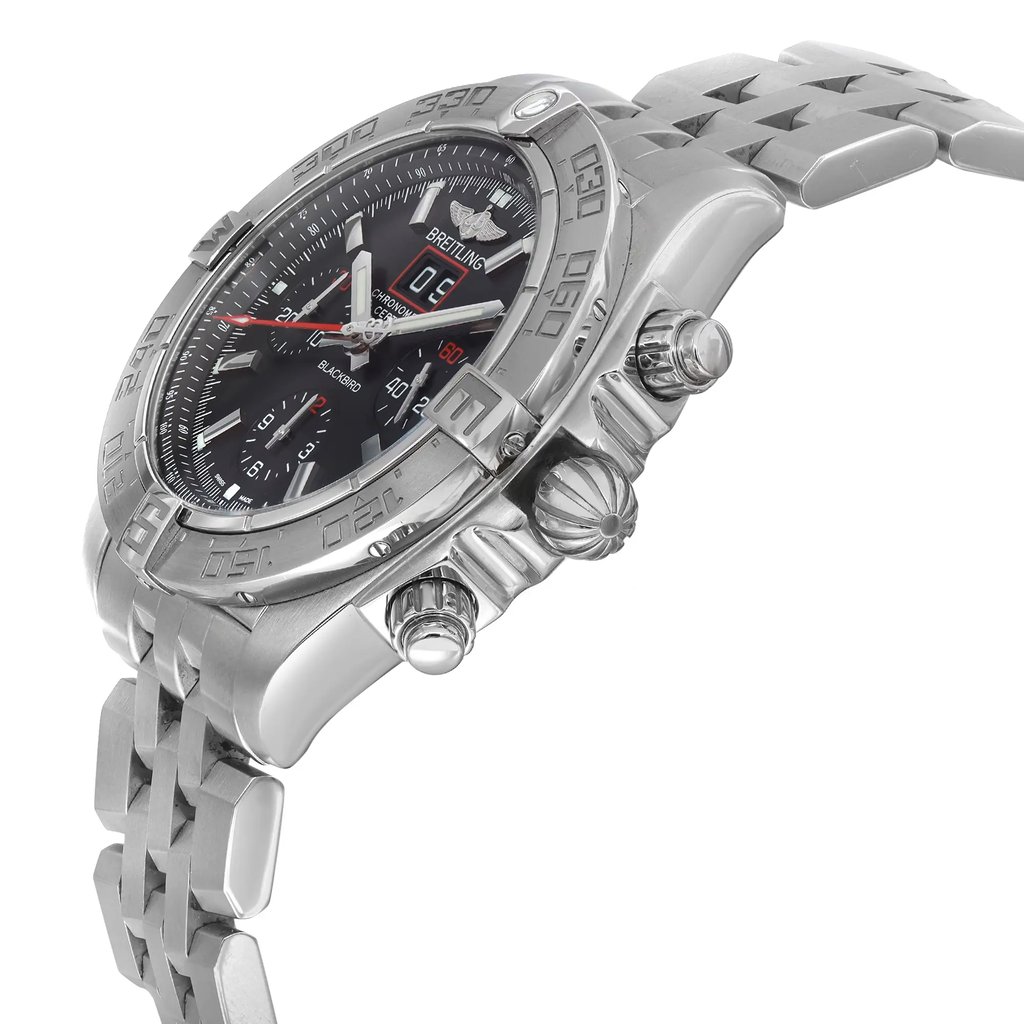 An image of a pre-owned Breitling men's wristwatch in a pilot/aviator style, captured from a side profile angle highlighting the crown. The watch features a round stainless steel case and band, with a gray bezel and black dial. The view is close enough to detail the chronograph functions, date indicator, and luminous hands, along with a small seconds subdial. The timepiece is positioned with the watch face slightly tilted towards the viewer, emphasizing its depth and design details. The watch shows light signs of wear or scratches. 
