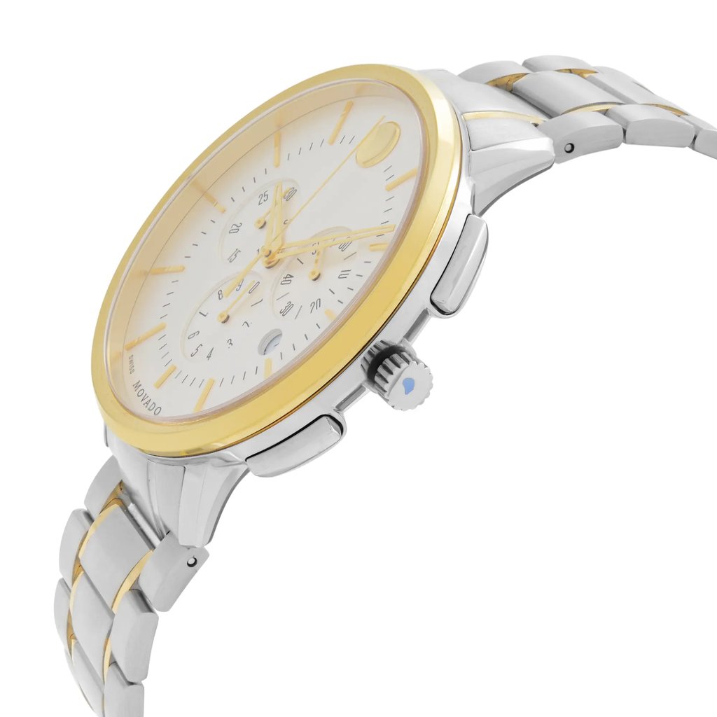 An image of a wristwatch shown from a side profile view with the crown clearly visible. The watch features a silver and gold-toned metal bracelet. The watch face is white with gold accents and multiple subdials. The watch is positioned at a slight angle, highlighting its sleek design and components. The image is taken at a close distance to emphasize detail.