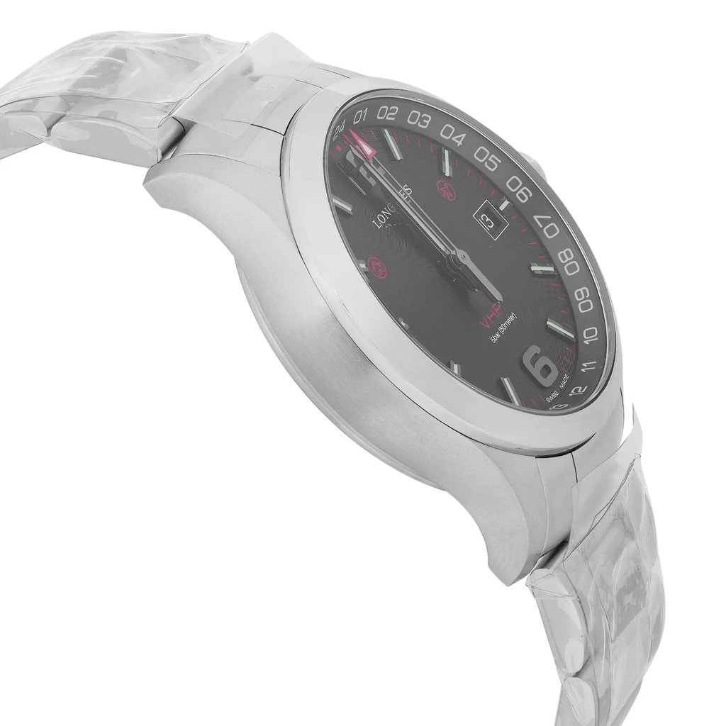 An image of a wristwatch taken from a side profile view, opposite the crown. The watch displays a sleek, metallic finish with a black dial featuring white and red accents, and a date window. The image is captured at a close distance, highlighting the watch's design and craftsmanship. The bracelet is partially wrapped in protective plastic, indicating its display model status.