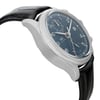 An image of a pre-owned IWC men's pilot/aviator wristwatch, presented in a side profile view opposite of the crown. The watch features a round stainless steel case with a gray bezel and a sunburst blue dial, which is visible at a close distance. Detailed with white and red accents, the dial includes Arabic numerals, three hands, and two sub-dials. Attached is a black leather band, curving away from the bottom of the watch, showcasing the watch's design and angle.