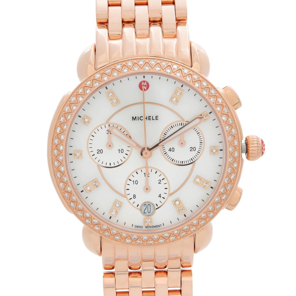 An image of a wristwatch captured from the front in a close-up shot. The watch face is prominently displayed, showcasing its intricate design and details. The watch features a rose gold-tone case adorned with a patterned bezel and has a white dial with multiple sub-dials and diamond indices. The linked bracelet is partially visible at the top and bottom edges of the image.