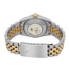 An image of a pre-owned wristwatch viewed from the back, showing a close-up of the clasp. The watch features a two-tone metal bracelet in silver and gold. The case back is visible, along with a worn sticker or engraving. The clasp is prominently displayed at the bottom of the image, slightly angled, with a crown emblem etched on it. The photograph is taken from a close distance, capturing the details of the watch's materials and design.