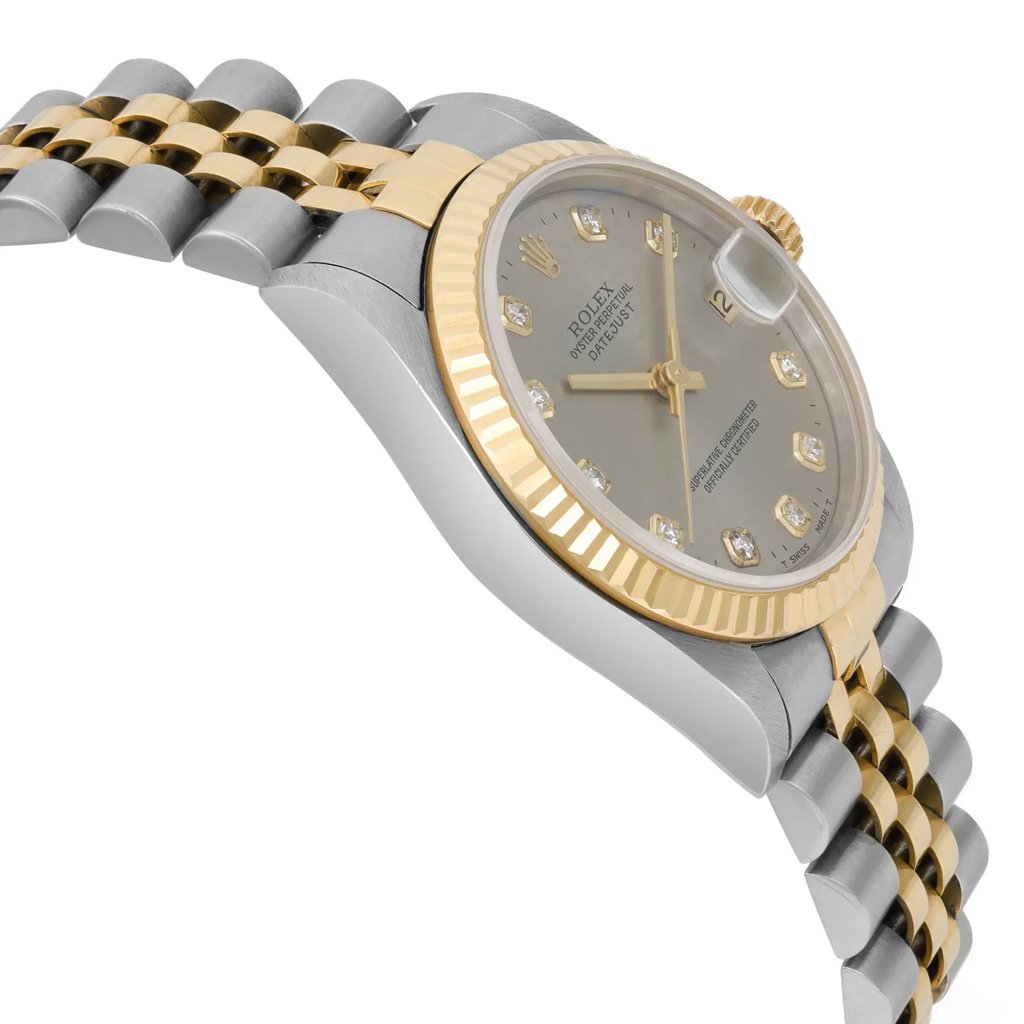 An image of a pre-owned wristwatch viewed from the side profile, opposite the crown. The watch features a two-tone metal bracelet with gold and silver links. The face has a gold bezel and a gray dial, with diamond hour markers visible. The angle highlights the watch's thickness and the curve of the bracelet, captured from a close distance.