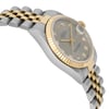 An image of a pre-owned wristwatch viewed from the side profile, opposite the crown. The watch features a two-tone metal bracelet with gold and silver links. The face has a gold bezel and a gray dial, with diamond hour markers visible. The angle highlights the watch's thickness and the curve of the bracelet, captured from a close distance.